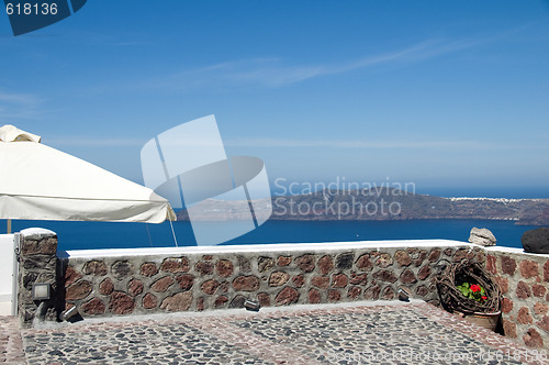 Image of stone patio view of volcanic islands santorini greece