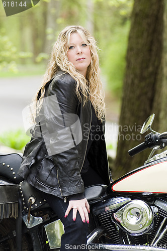 Image of sexy woman on classic motorcycle