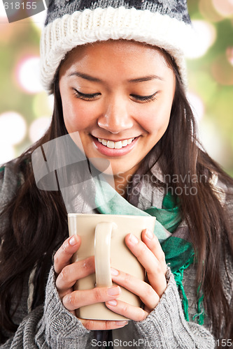 Image of Beautiful asian woman drinking coffee