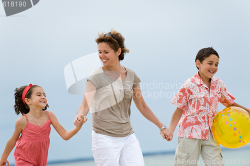 Image of Mother and kids on the beach
