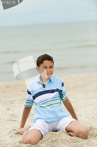 Image of playful kid on the beach