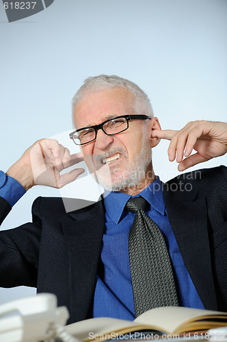 Image of Stressed senior businessman