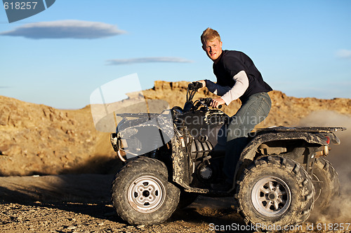 Image of quad - teen driving four wheeler