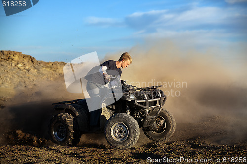 Image of teen on quad four wheeler