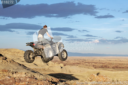 Image of teen on quad - four wheeler