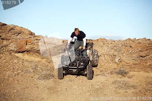 Image of teen on quad