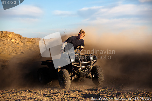 Image of riding ATV - teen on quad