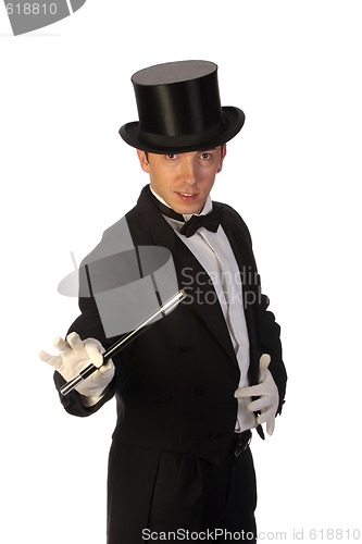 Image of young magician performing with wand 