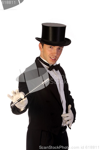 Image of young magician performing with wand 