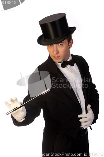 Image of young magician performing with wand 