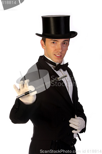 Image of young magician performing with wand 