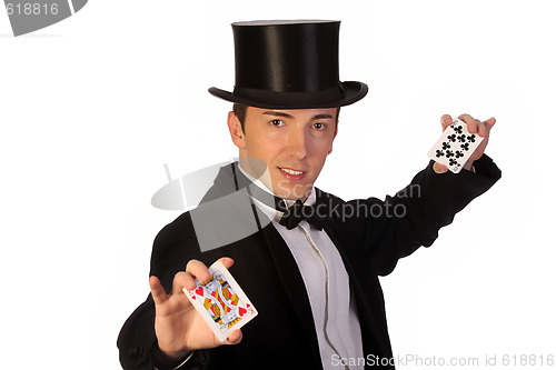 Image of young magician performing with cards