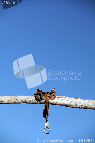 Image of saddle on a post