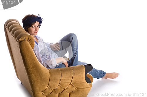 Image of woman sitting in armchair