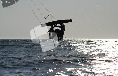 Image of  kiteboarder upside down jump