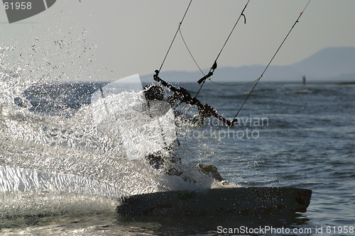 Image of kite boarder carving his board