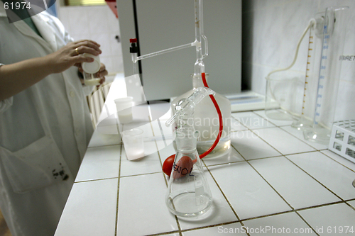 Image of laboratory technician testing dairy products