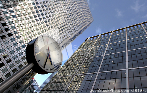 Image of clock and office buildings