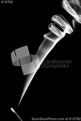 Image of Stick with a white smoke. Isolated on black