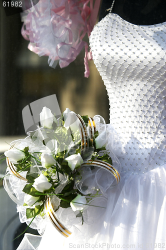 Image of bridal gown and bouquet