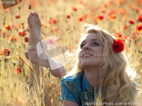 Image of Barefoot blonde in poppies