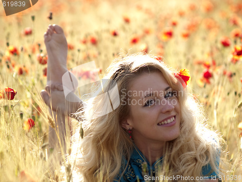 Image of Barefoot blonde in poppies