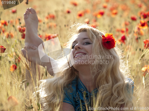 Image of Barefoot blonde in poppies