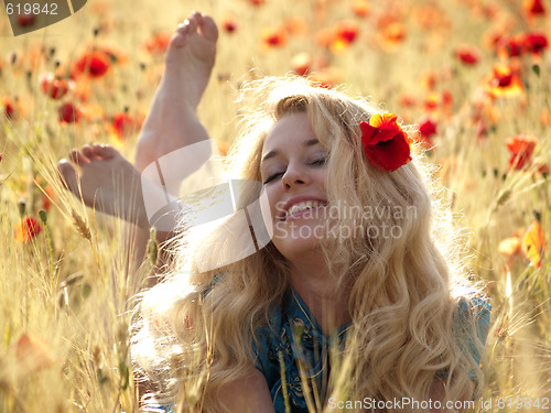 Image of Barefoot blonde in poppies