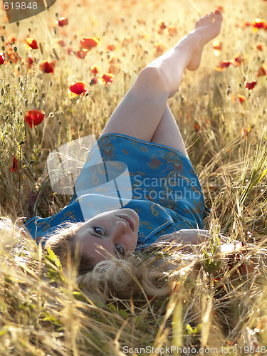 Image of Barefoot blonde in poppies