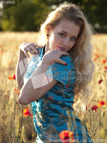 Image of Blonde in poppy field