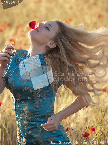 Image of Blonde in poppy field