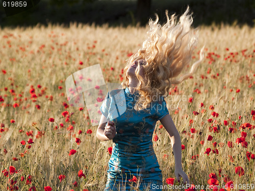 Image of Blonde in poppy field