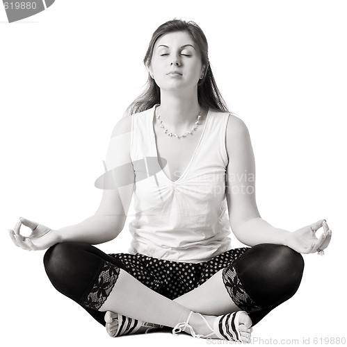 Image of young woman practicing yoga