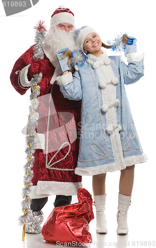 Image of Santa Claus and snow maiden dancing