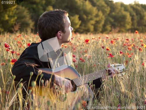 Image of Guitarist in field