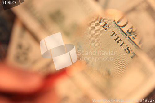 Image of The back side of the banknote is under a magnifying glass