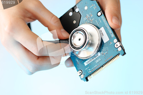 Image of Doctor holding stethoscope at notebook hdd