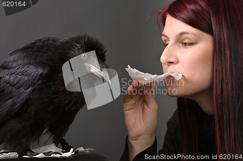 Image of young woman with raven