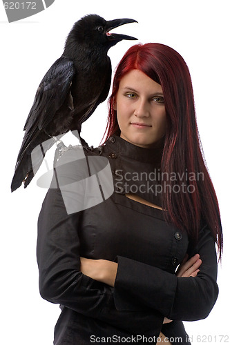 Image of young witch with raven