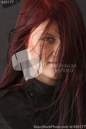 Image of glance through red hair