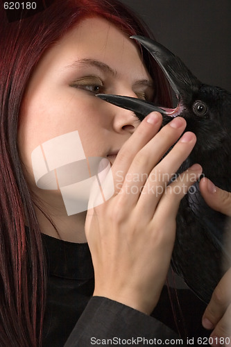 Image of young woman with raven