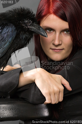 Image of beautiful witch with raven