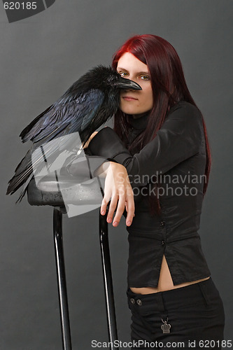 Image of beautiful witch with raven