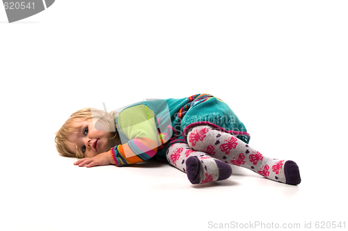 Image of Baby lies on the floor