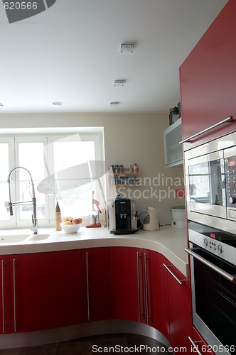 Image of Red modern kitchen.