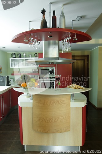 Image of Red modern kitchen. Interiors.