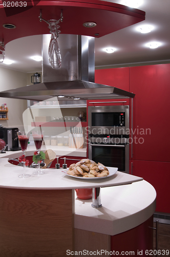 Image of Red modern kitchen. 