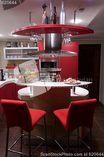 Image of Red modern kitchen. 