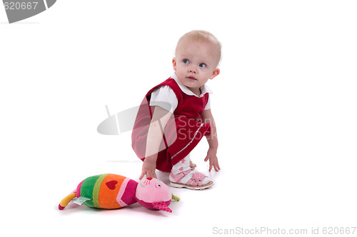 Image of Baby sitting on the floor