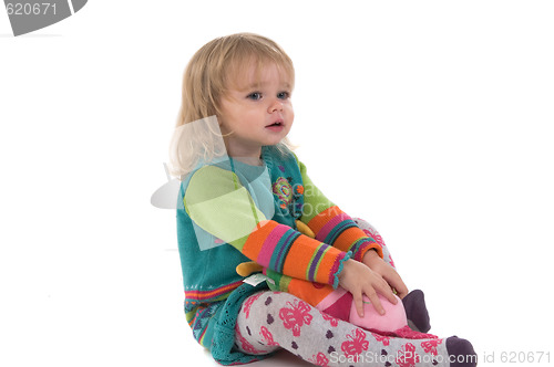 Image of Baby sitting on the floor